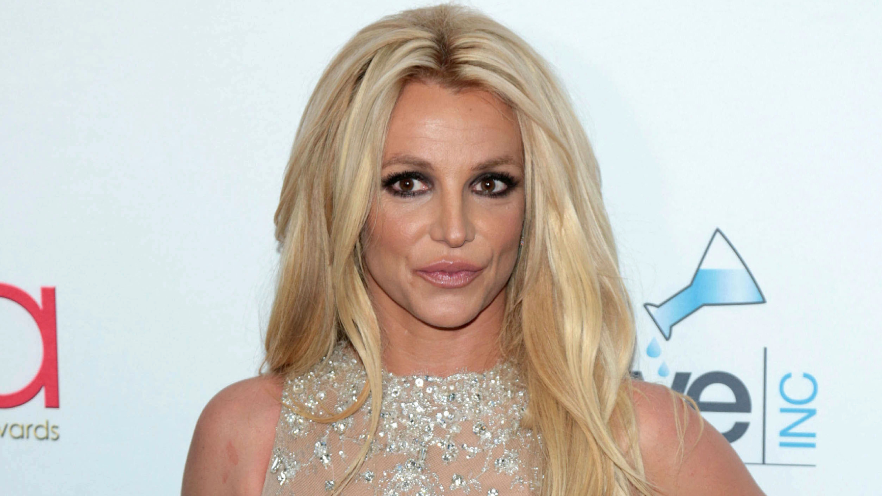 Pregnant Britney Spears wearing nothing as she cuddles with cute dog Sawyer